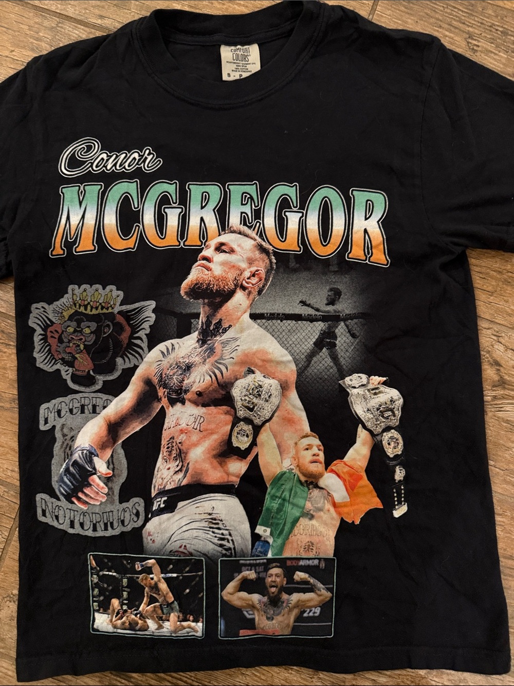 McGregor Black Graphic Tee with Green and Orange Accents